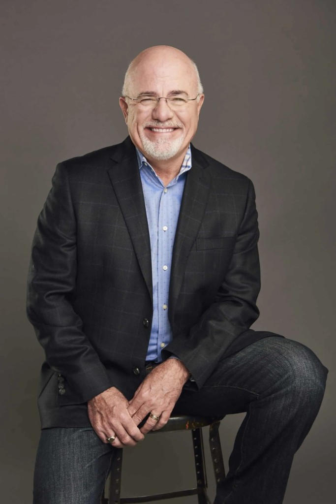 Dave Ramsey seated and smiling in a professional portrait