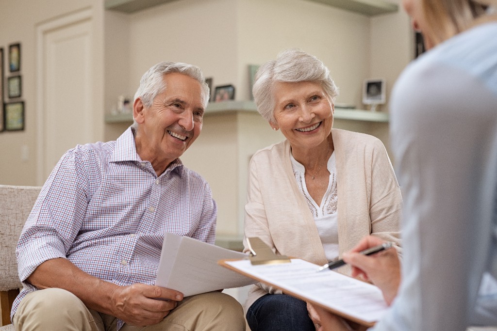 Retired couple reviewing their estate plan with an advisor